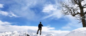 man standing in a winter scene