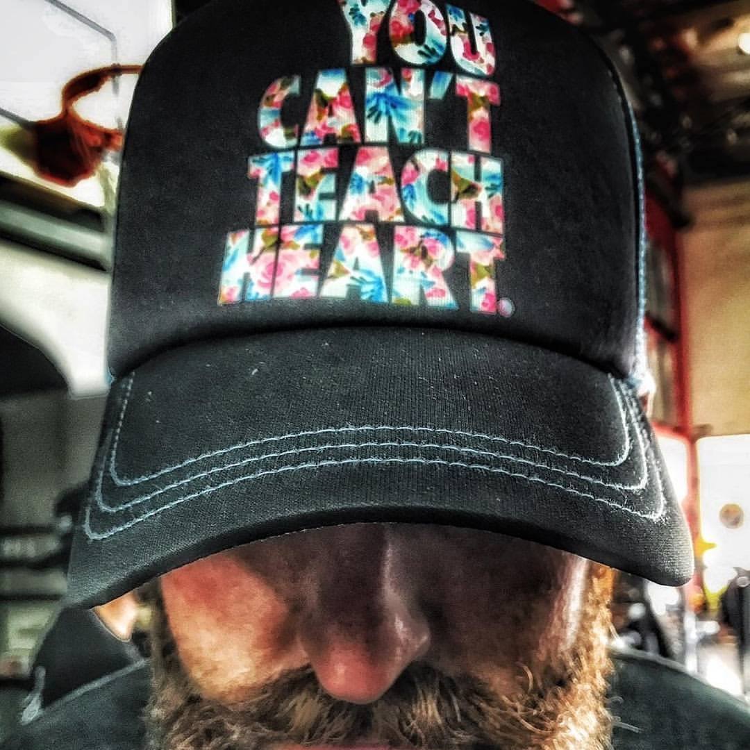 Cale Shultz wearing a You Can't Teach Heart Cap