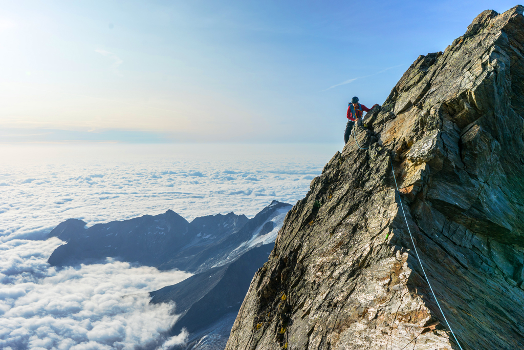 Man climbing mountain - risky