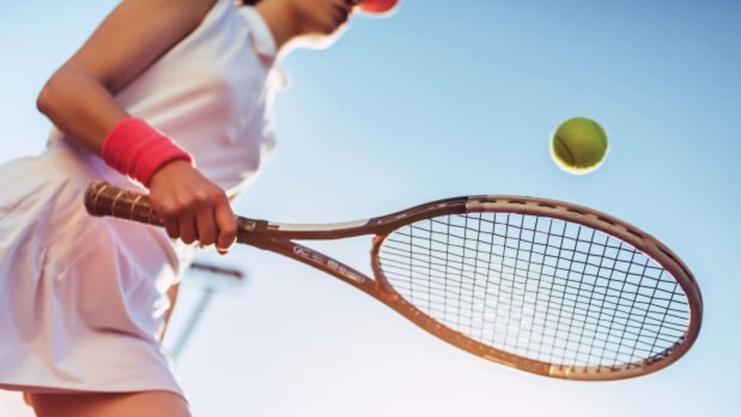 Woman playing Tennis